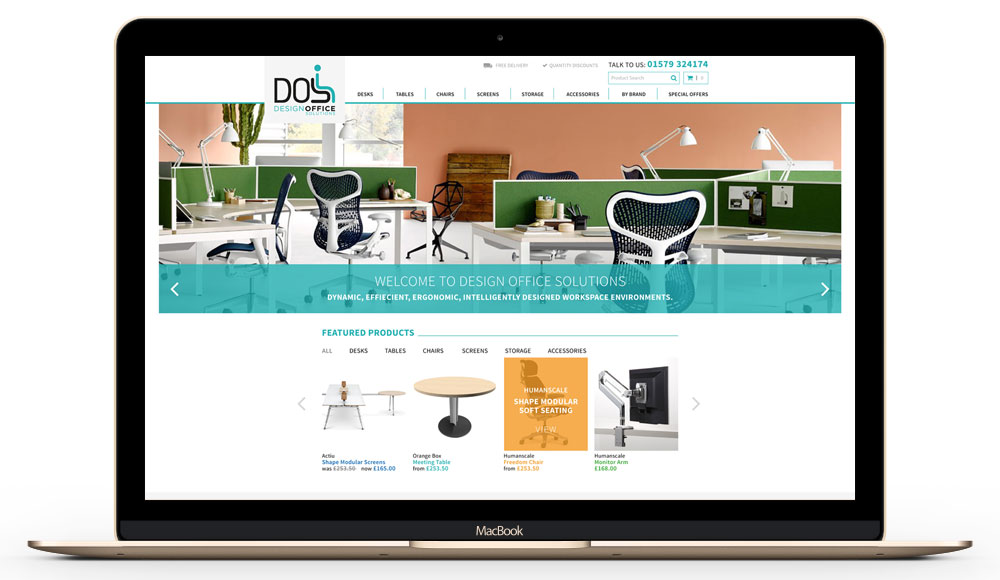 The design Office Solutions e-commerce website is displayed on a laptop device. Designed and built by Oracle Design.