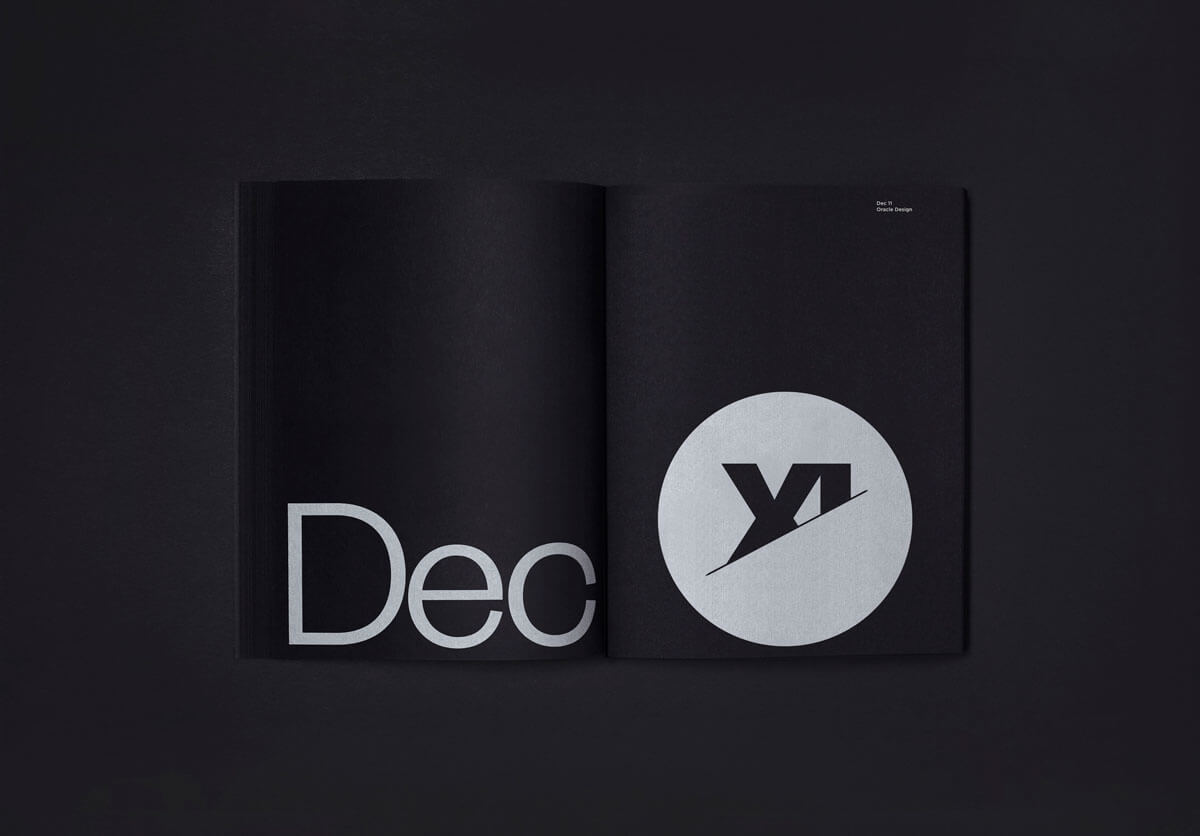 The Oracle designed page for the Fedrigoni 365 brochure. A black page with a white circle with the number 11 as roman numerals.