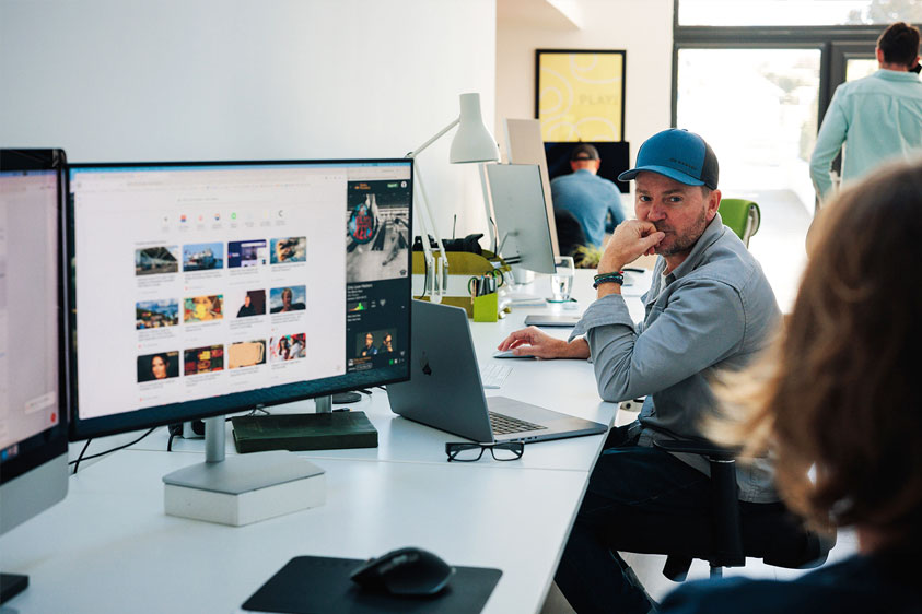 The Oracle Design Studio in Newquay. Showing 3 desks with PC's and chairs
